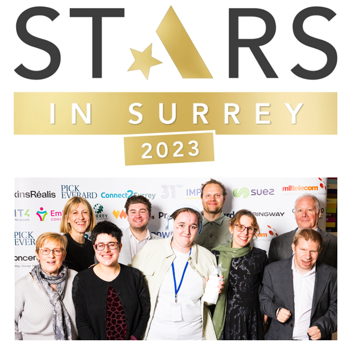 Group of smiling Include staff, members and volunteers at the Stars in Surrey Awards event - winners