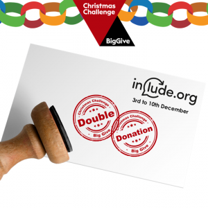 Traditional ink stamper showing two stamps on a pience of paper that says include.org 3rd to 10th December Big Give Logo and some paper chains showing at the top