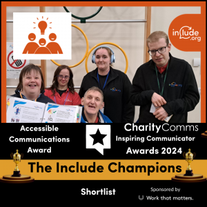 A photo of 5 members of The Include Champion's Group holding a folder of Easy Read resources that that they have been consulted on