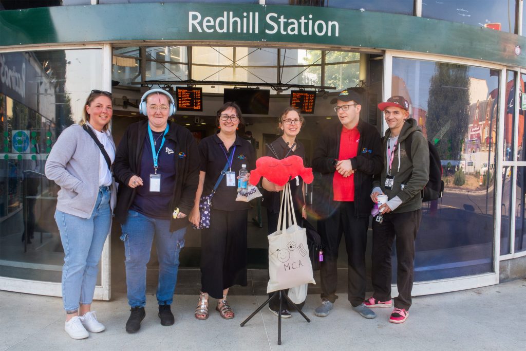 Include Members and staff outside Redhill train station