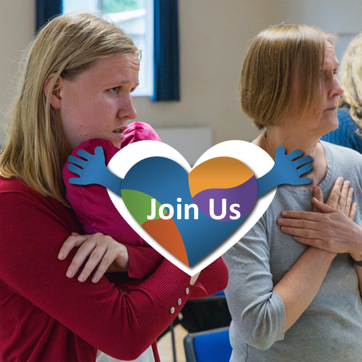 Photo of two people at Include Choir Makaton sign for Love