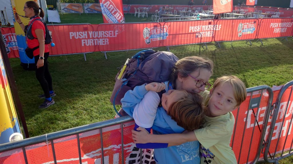 Alix receives big hugs from her two boys