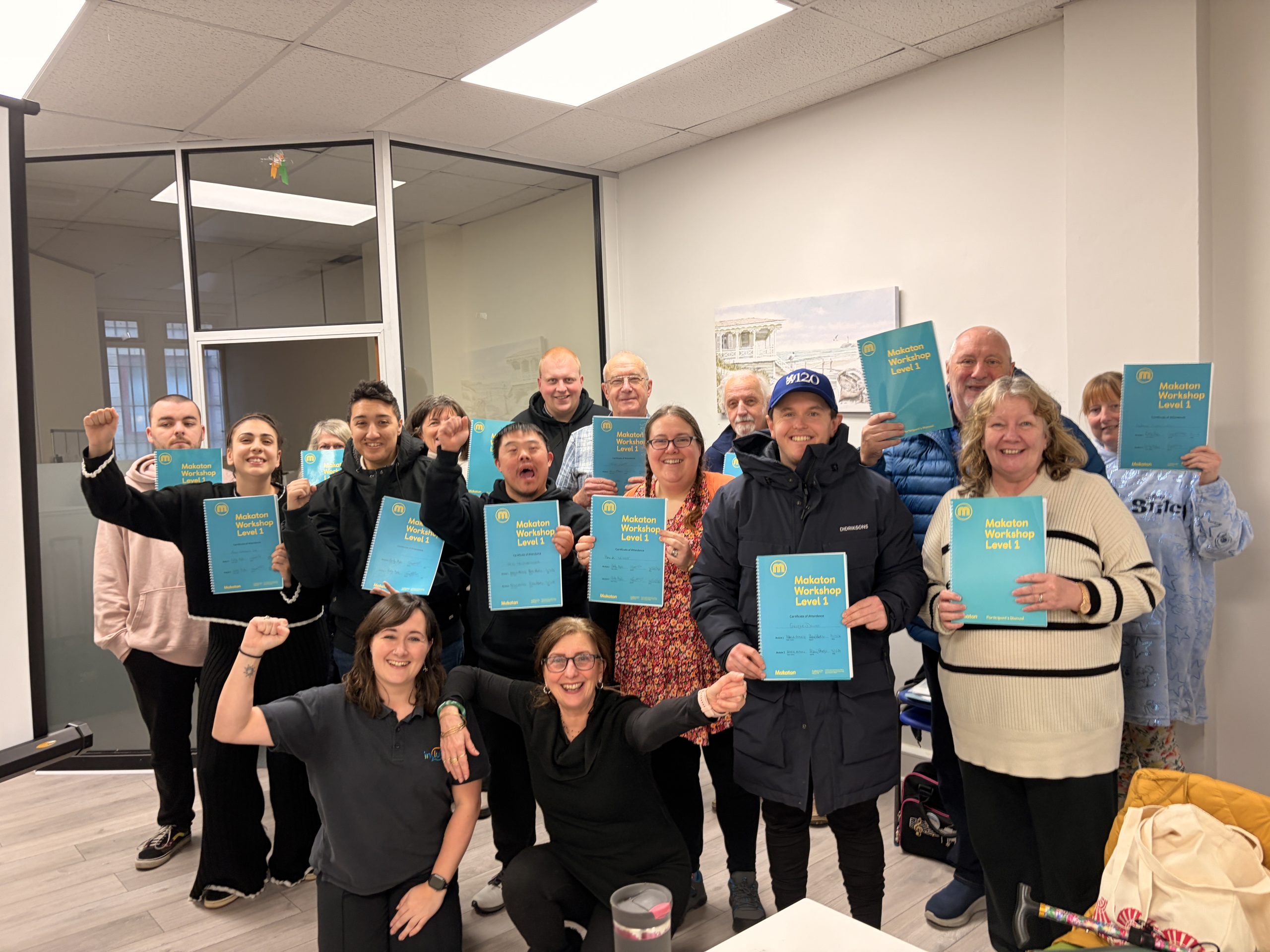 Group of people proudly showing their Makaton certificates