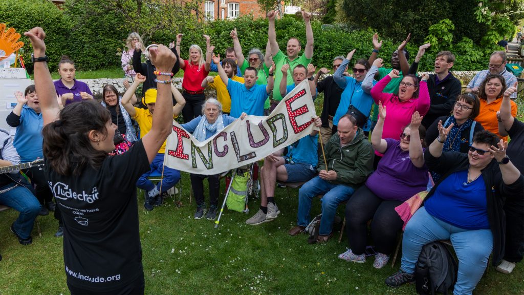 Include members outside with both hands raised happily joining in